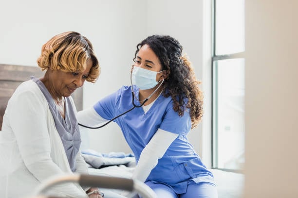 Cardiology Nurse Helping Patient