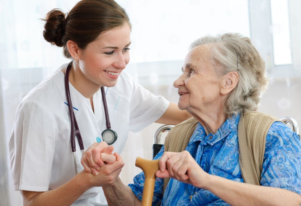 Long-Term Care Nurse Helping Patient