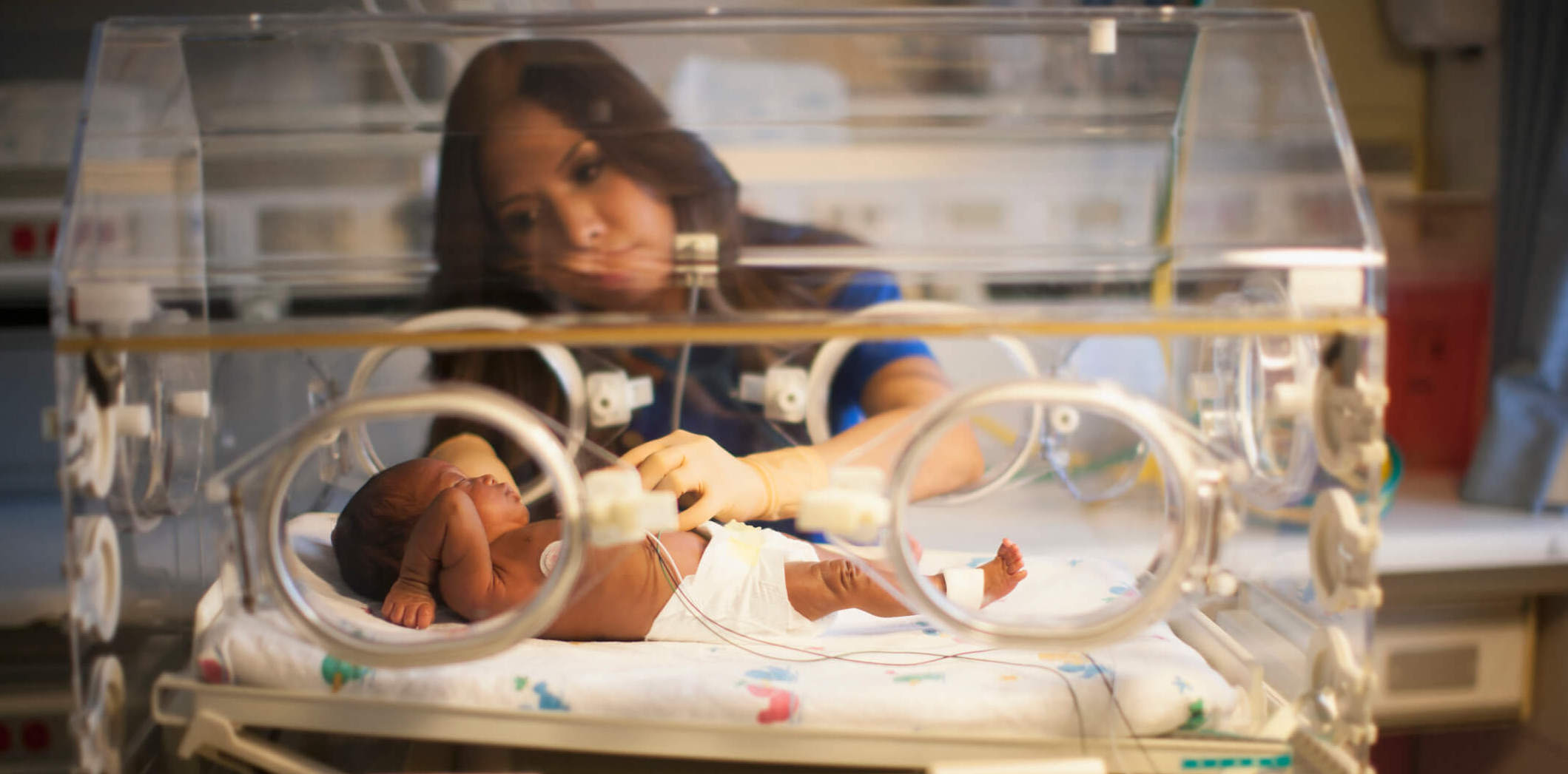Neonatal Nurse Helping Baby