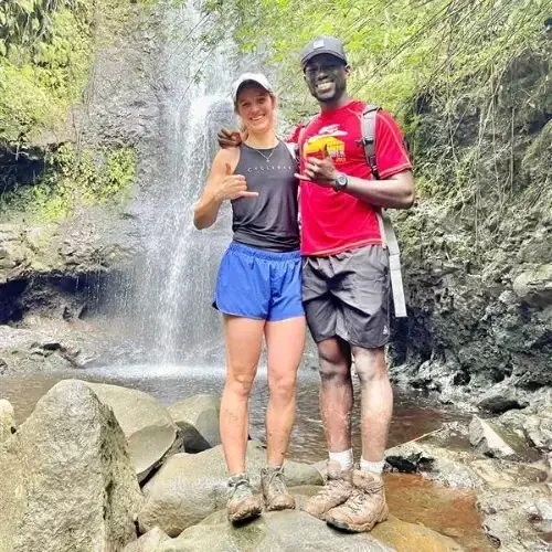 Anders travelers at a waterfall in Hawaii